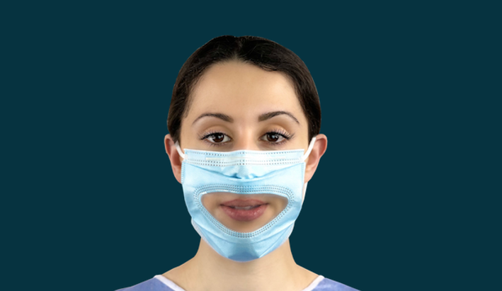 Lady wear face mask with a clear panel for lip reading